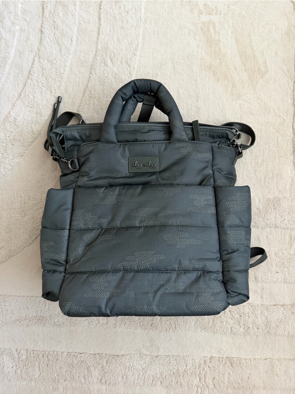 Itzy Ritzy Quilted Puffer Backpack in Charcoal with Subtle Dot Print